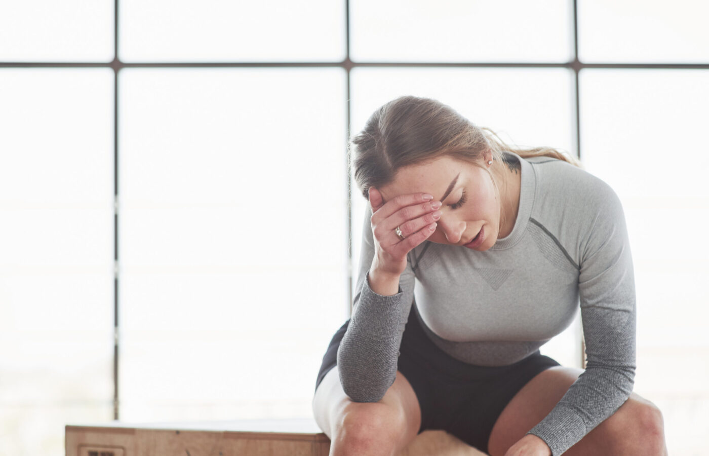 Tired after workout. Sportive young woman have fitness day in the gym at morning time Tired after workout. Sportive young woman have fitness day in the gym at morning time.